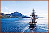 La poppa dell'Amerigo Vespucci e l'isola di SantoJanni - 26 settembre 2026.jpeg